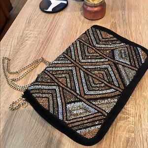 Beaded clutch bag with velvet exterior and interior.